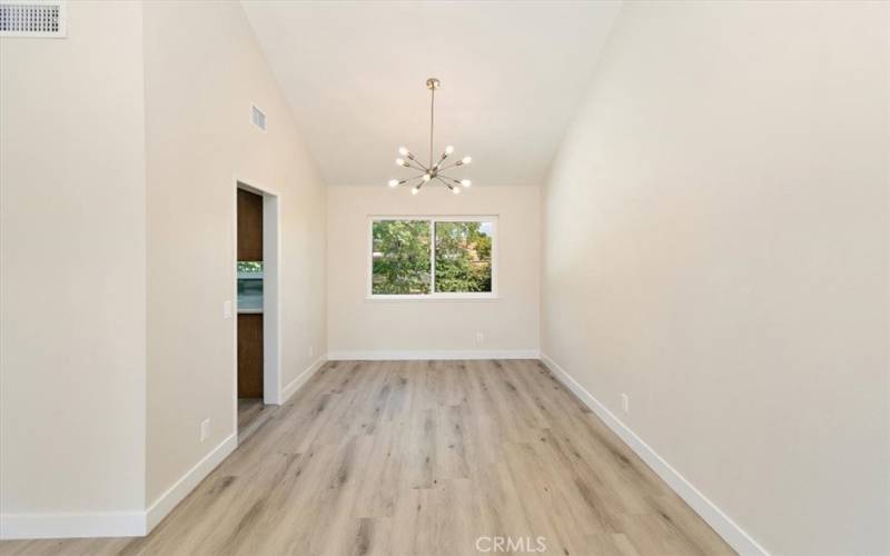 Dining Room with Beautiful Modern Light Fixture