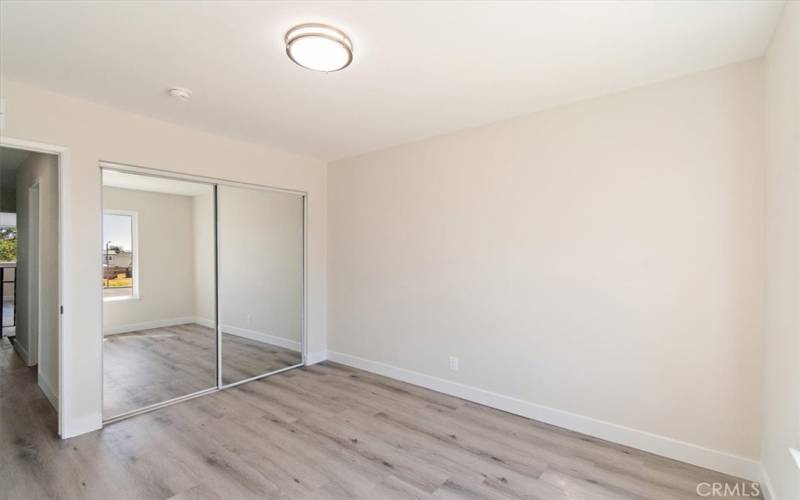 Fourth Bedroom with Mirrored Closet Doors