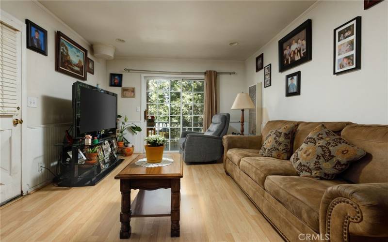 Apalrtment living room with sliding glass door to attached deck.