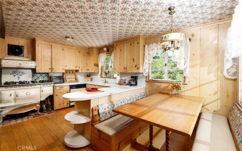 Country kitchen with banquette seating.