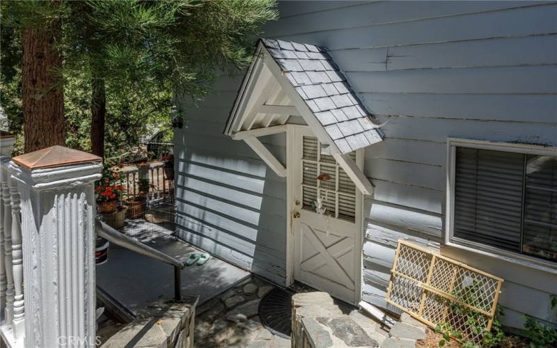 Entrance to lower level apartment under garage.