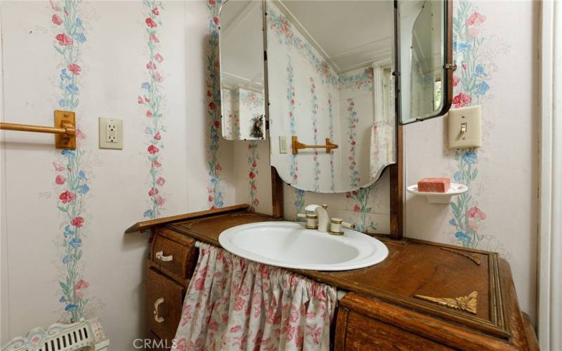 Upstairs half bath.