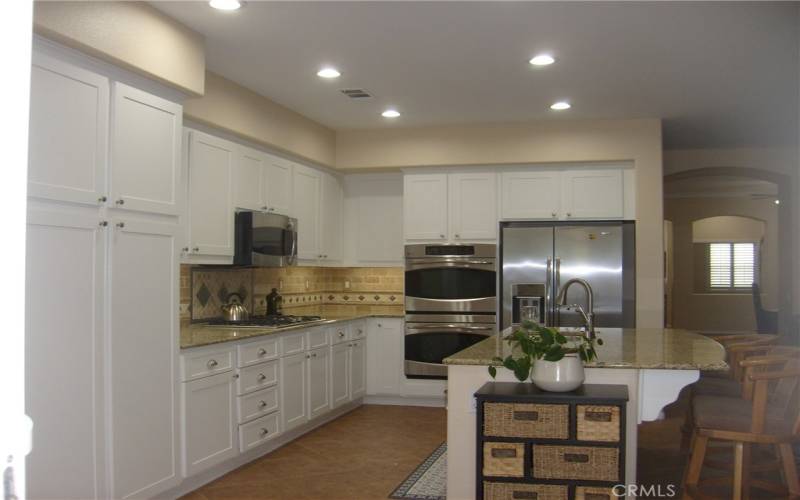 Kitchen Includes Gas Stove Stainless Steel Dbl Oven, Refrigerator and Microwave.