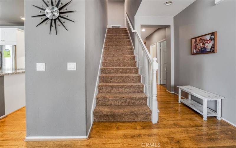 Stairs going up to guest/additional master suite