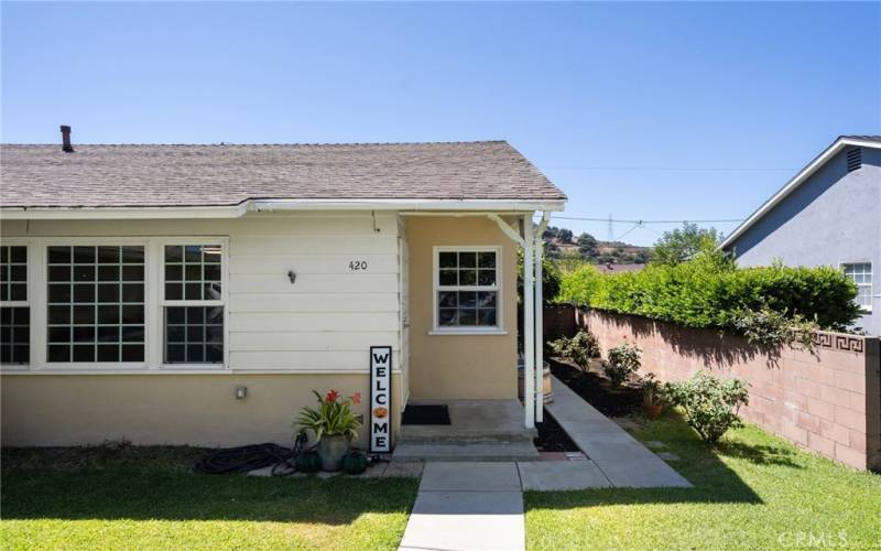 covered patio and large side yard area