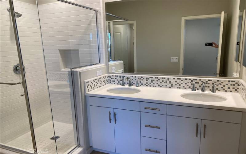 Bedroom #1 has bathroom with two sinks and a walk-in shower.
