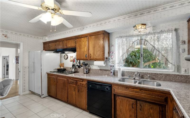 A spacious eat-in kitchen with granite counter tops and a large breakfast nook.