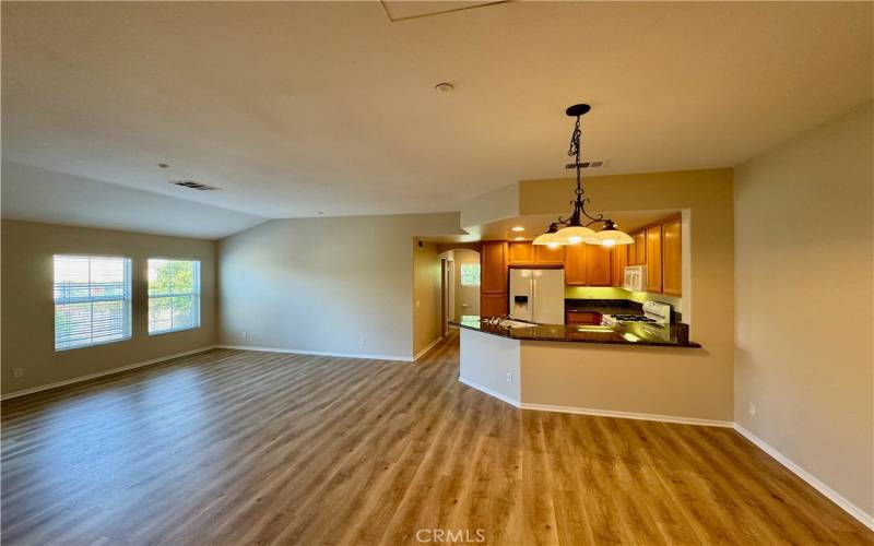 Kitchen looking down hall to 2nd bedroom