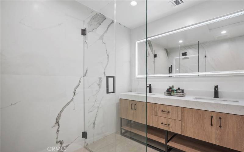 The primary bathroom includes a vanity with double sink.