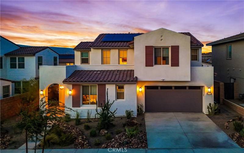 Front exterior of home at twilight.