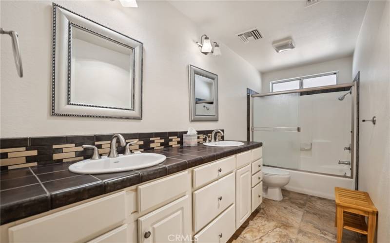 Guest bathroom with dual vanities