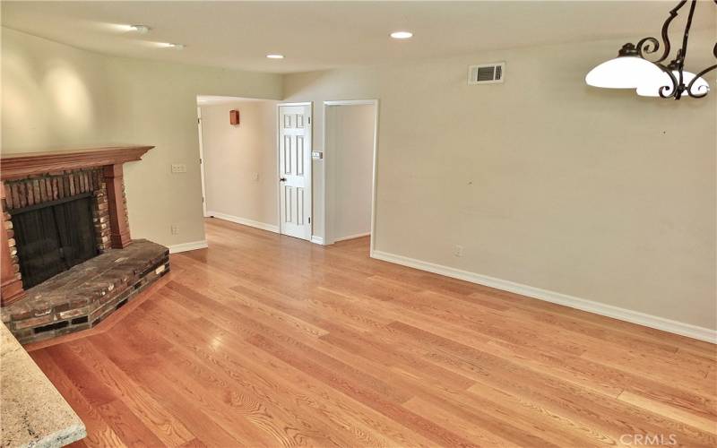 family/dining room overlooking the warm romantic brick gas fireplace