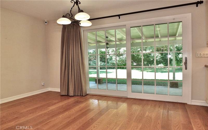 sliding patio door leading to the secluded serene backyard