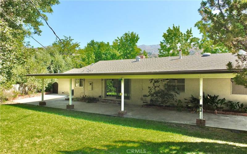 secluded serene backyard perfect for entertaining with a adequate sized side yard