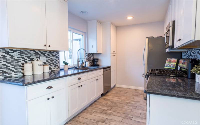 Remodeled kitchen with striking backsplash and added pantry