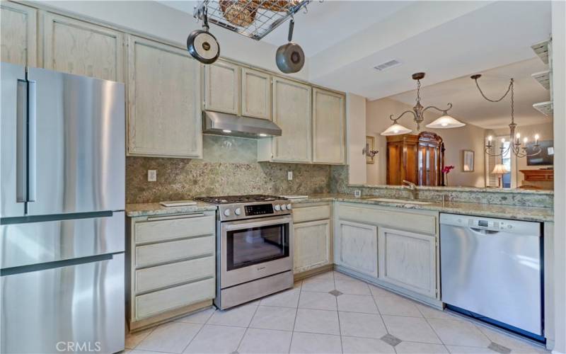 Upgraded kitchen with stainless steel appliances.