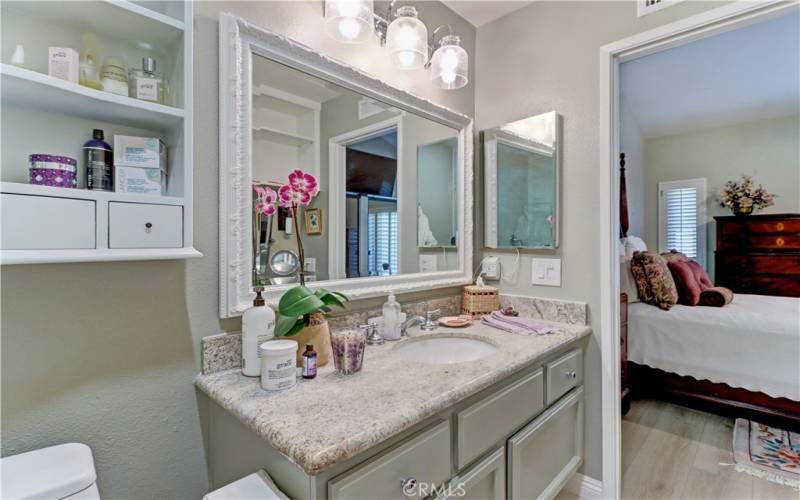 Vanity with granite counter top.