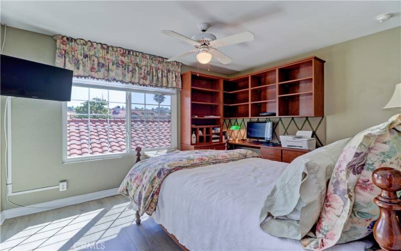 Secondary bedroom with built in cabinets.