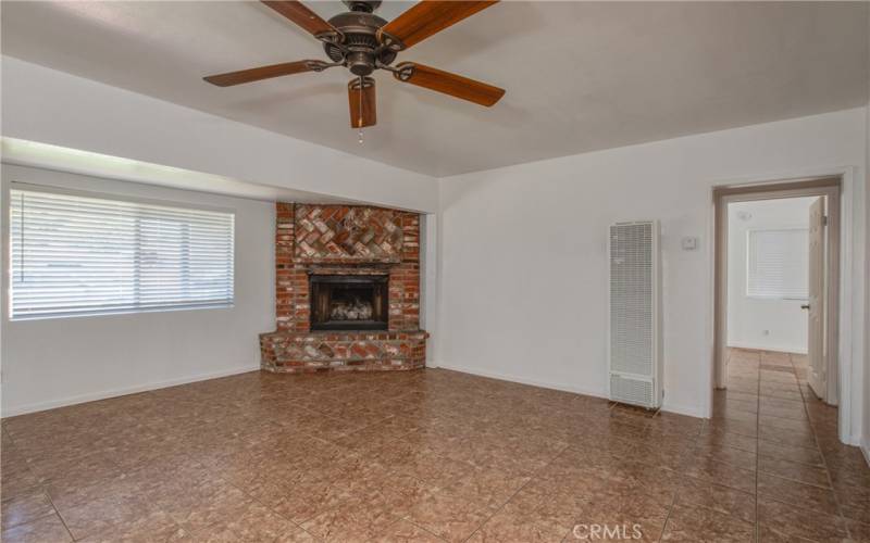 Entering the main house you are greeted with tile flooring, large windows and ceiling fans throughout the home.