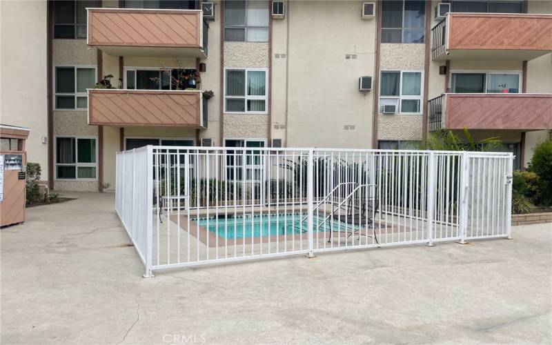 In ground  fenced jacuzzi well kept by HOA