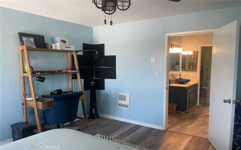 Bedroom with wood flooring