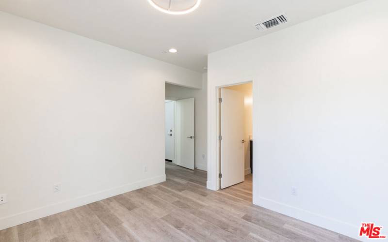 bedroom 3 on first level with attached bathroom