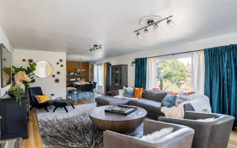 Living room with a nice window to view side patio.