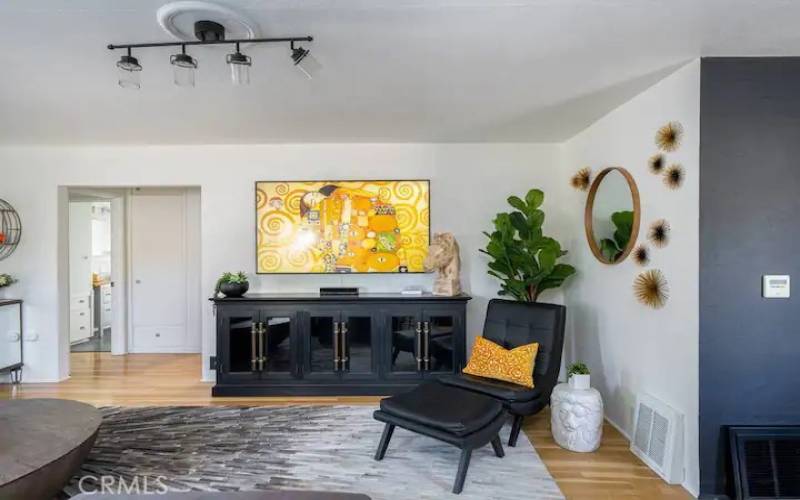 Another view of living room with beautiful wood floors.