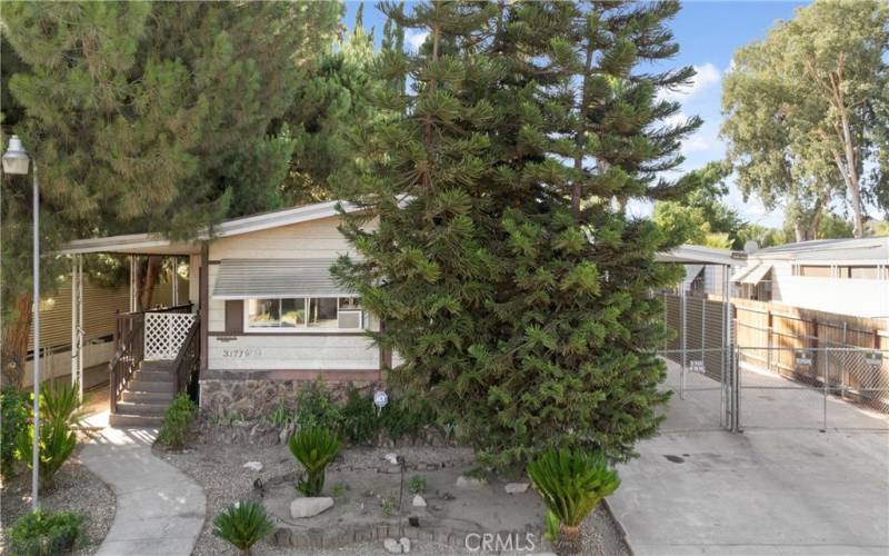 Mature landscaping and covered patio provide lots of shade.
