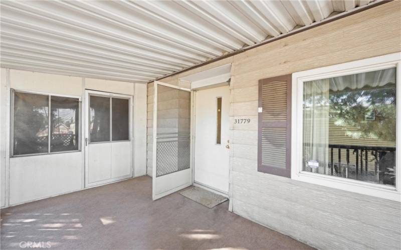 Covered front porch is perfect for a nice shady spot to relax!
