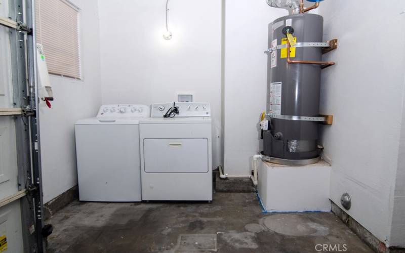 W/D and hot water heater inside garage