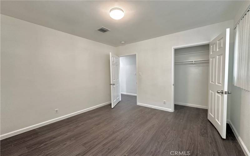 The first bedroom has view of the front yard