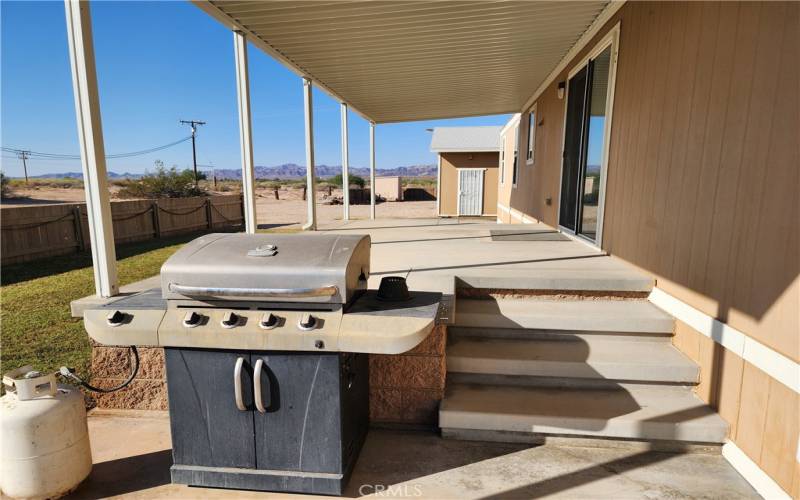 Steps to covered patio and slider door