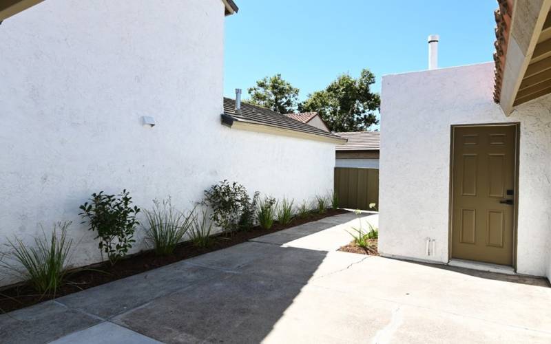 SIDE YARD AND ENTRANCE TO 2 CAR GARAGE