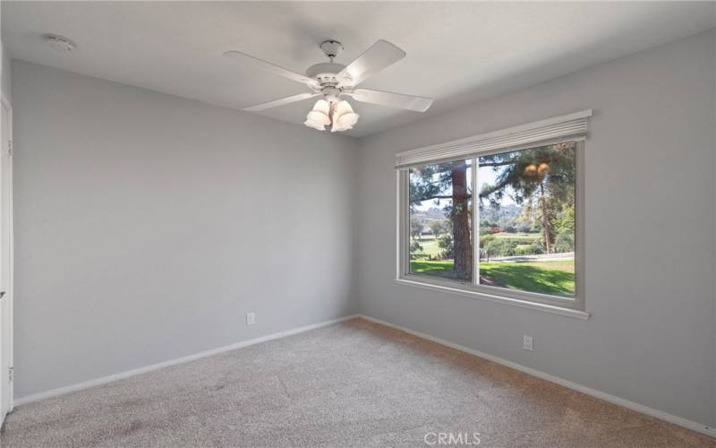 Secondary bedroom with greenbelt & golf course view.