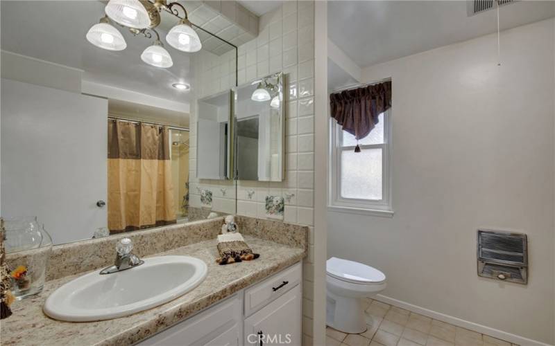 Master Bathroom with newer vanity top and all New Paint. This has tub/shower combination.

 Guest bath has shower only.