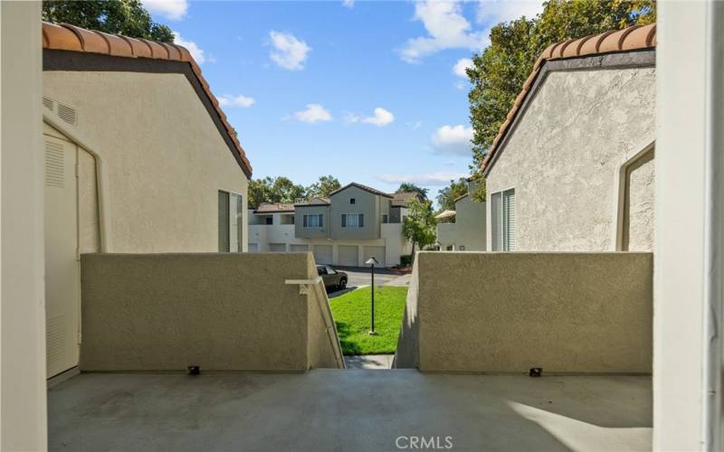 shot of patio to staircase from front door