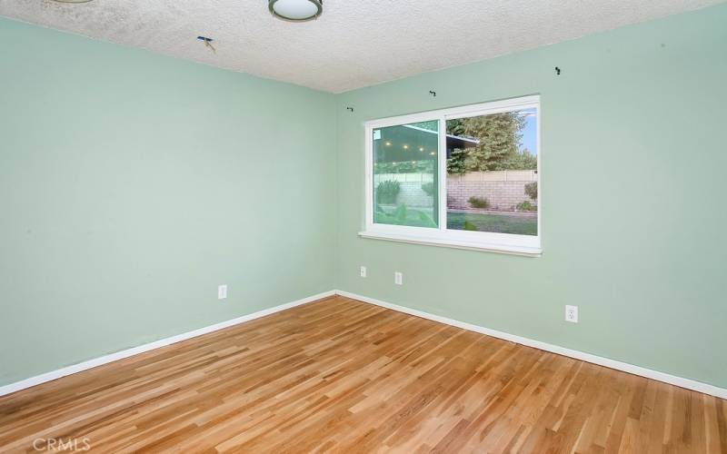 2 additional freshly painted bright and airy bedrooms with new glistening windows, ample closet space to maximize storage and newly refinished original oak hardwood floors.