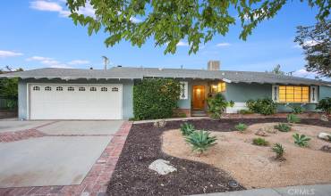 This wonderful home is located on a quiet street in one of Canoga Park’s most sought-after neighborhoods.  The eco-friendly landscaping, colorful flowerbeds and covered entryway enhance its eye-catching curb appeal.