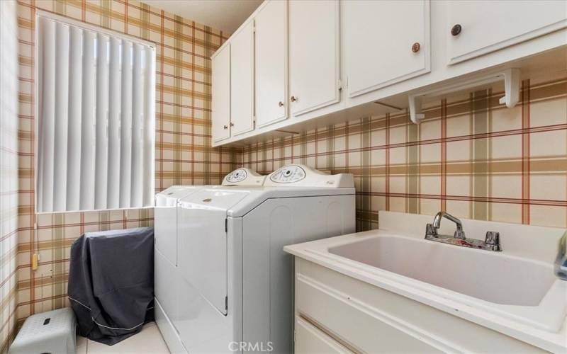 Laundry Room with Cabinetry & Utility Sink