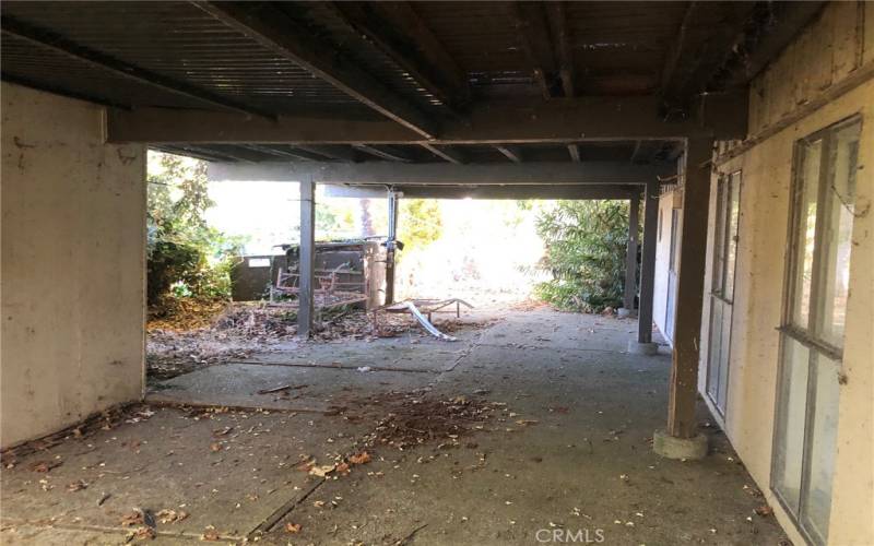 Lower level covered deck. Each of the sliding doors on this level leads to a bedroom and bathroom.