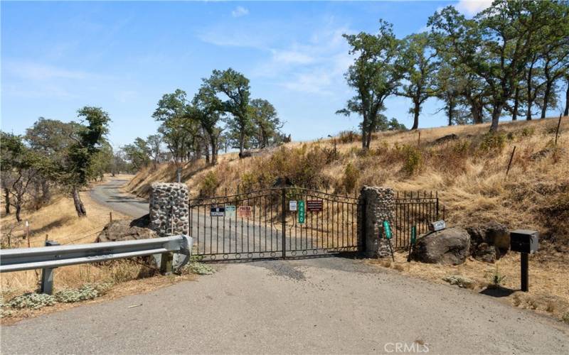 The Road is currenlty paved past the gate.
