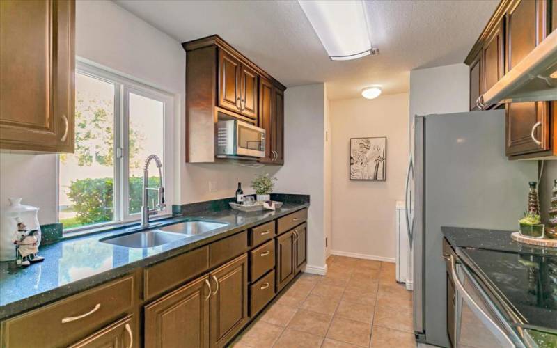 High end cabinetry, appliances & rich finishes make this home special.