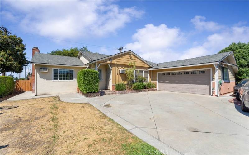 Front of the house with 2 car garage.