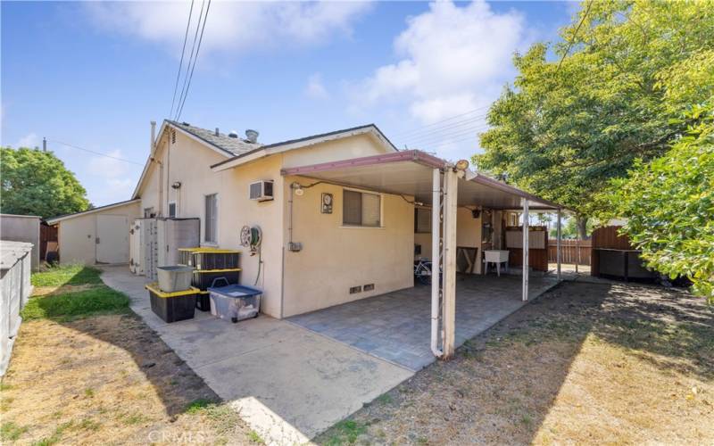 Large covered patio. Water heater is against the wall.