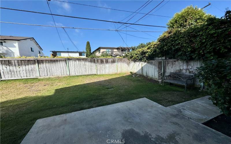 Fenced Backyard with gardener