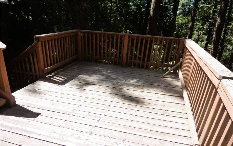 The Lower Level Deck Is A Very Nice Size And It Gives You Access To The Concrete Patio Area In The Trees Below