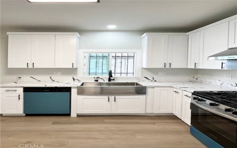 Kitchen with stainless steel appliances and farm house sink