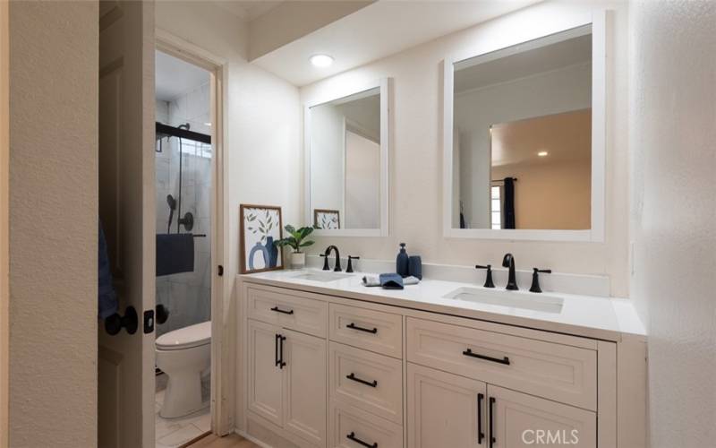 Master bath has dual vanities & separate shower/toilet area