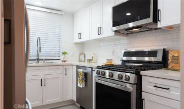 Remodeled kitchen with LGT gas stove & microwave